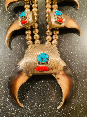 Pair of his and hers Vintage Navajo Pawn sterling Turquoise/Coral Squash blossoms with claws
