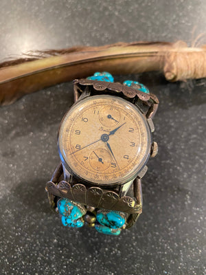 Navajo Pawn Turquoise Silver watch Cuff paired with a vintage authentic Brietling watch