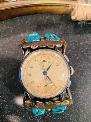 Navajo Pawn Turquoise Silver watch Cuff paired with a vintage authentic Brietling watch